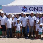 campagne consistant au nettoyage de la plage par la QNB