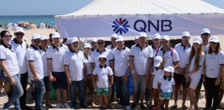 campagne consistant au nettoyage de la plage par la QNB