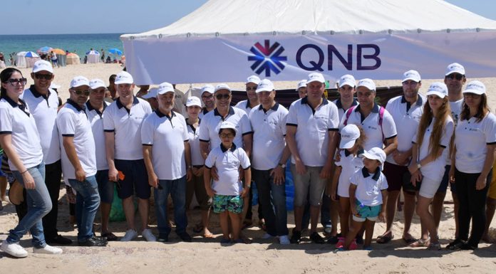 campagne consistant au nettoyage de la plage par la QNB