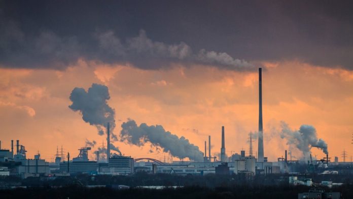 Dramatic sunset over industrial area